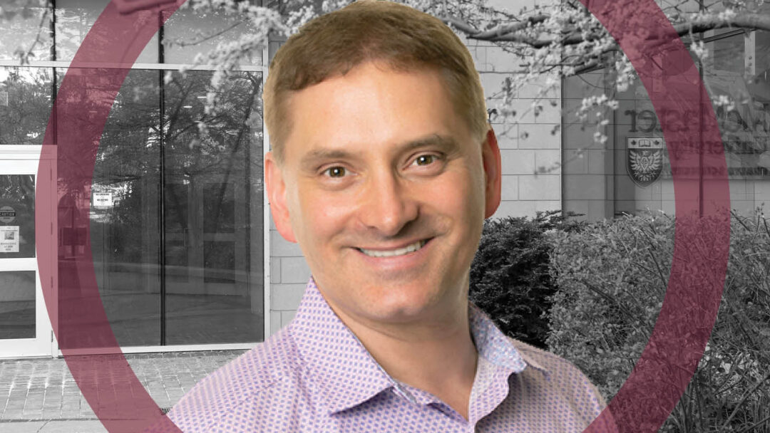 Dr. Jason Busse, wearing a patterned, collared shirt, in front of a black and white photo of the McMaster Health Science building.